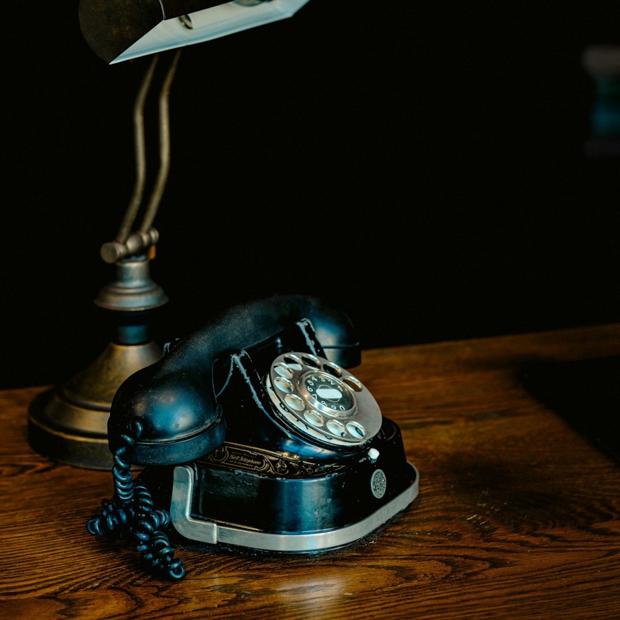 Vintage telephone and lamp on the front desk